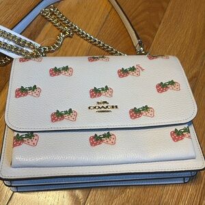 NWT never worn! Cute sparkle spring strawberry Coach bag. Multiple lengths. 9x7